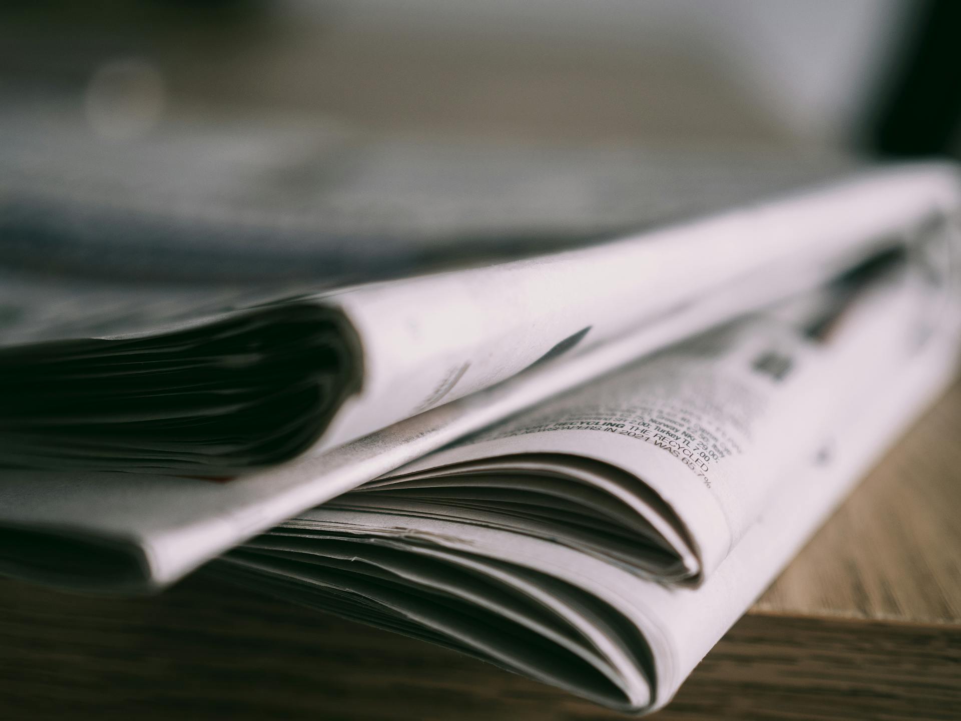 Close-up photo of a stack of newspapers. 